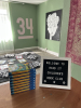 Welcome to Read It! Children's Book Club sign and books.